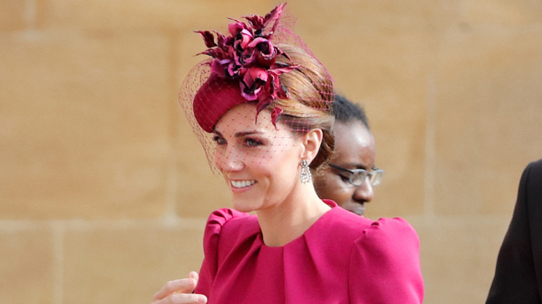 Catherine, Princess of Wales, in a burgundy fascinator at Princess Eugenie's wedding