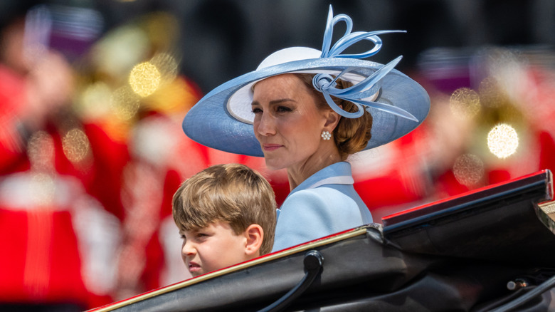 Kate Middleton sat next to Prince George wearing light blue Philip Treacy hat