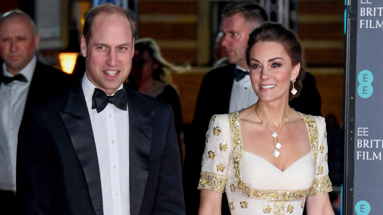 Prince William and Kate Middleton in a gold and white dress at the BAFTAs