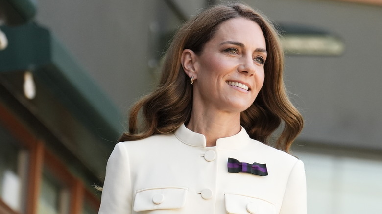 Kate Middleton in a cream top looking away from the camera