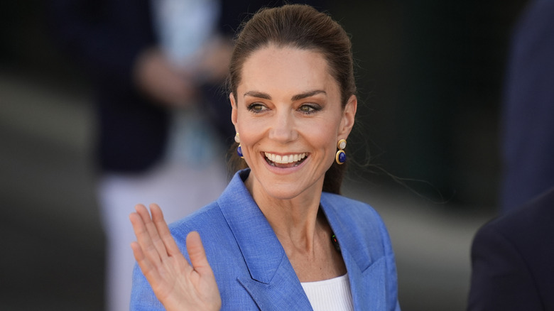 Kate Middleton waving and smiling to a crowd in 2026