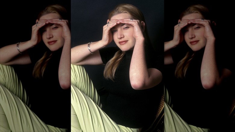 Kate Winslet posing with her hands over her eyes during a 1996 photoshoot