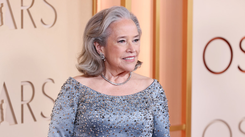 Kathy Bates wearing a gray gown with sequins