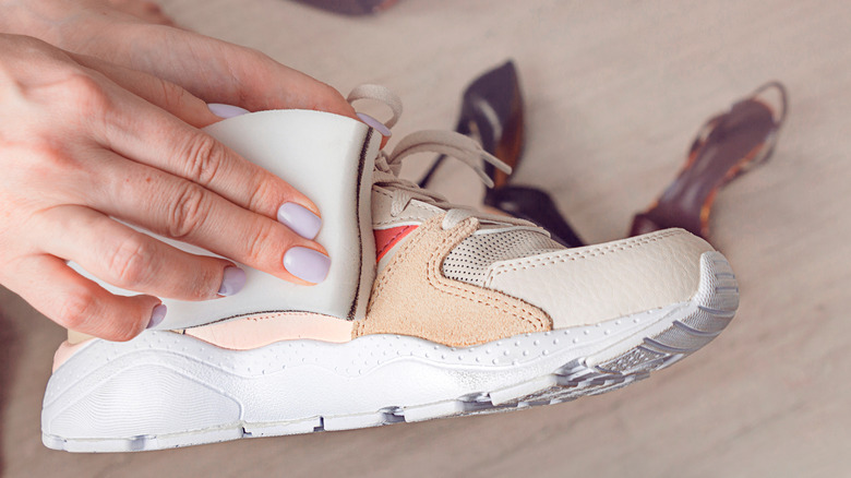 wiping off shoes with sponge