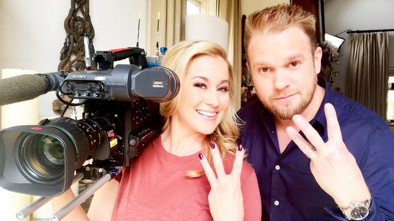 Kellie Pickler and Kyle Jacobs posing with a TV camera