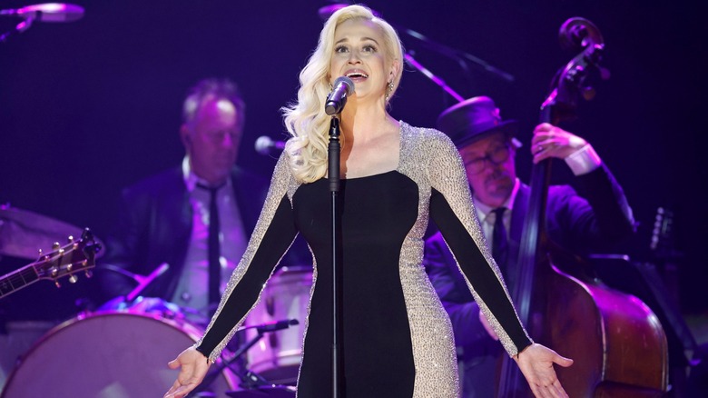 Kellie Pickler performing on stage in 2024
