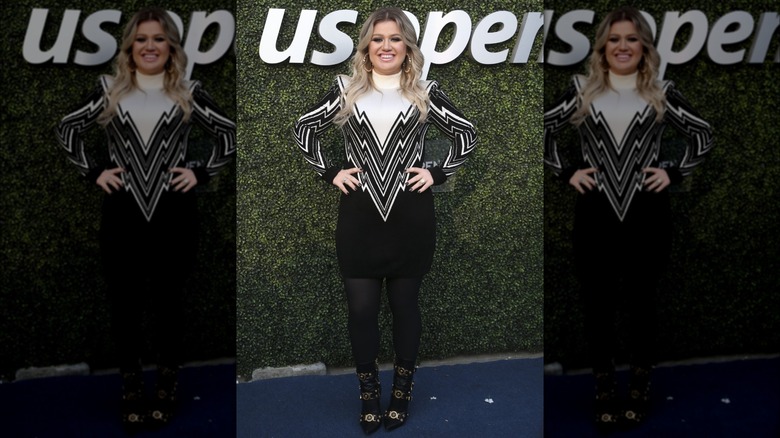 Kelly Clarkson on the red carpet in a black and white dress
