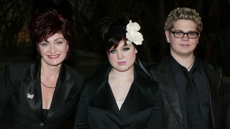 Kelly Osbourne with Sharon and Jack Osbourne in 2002