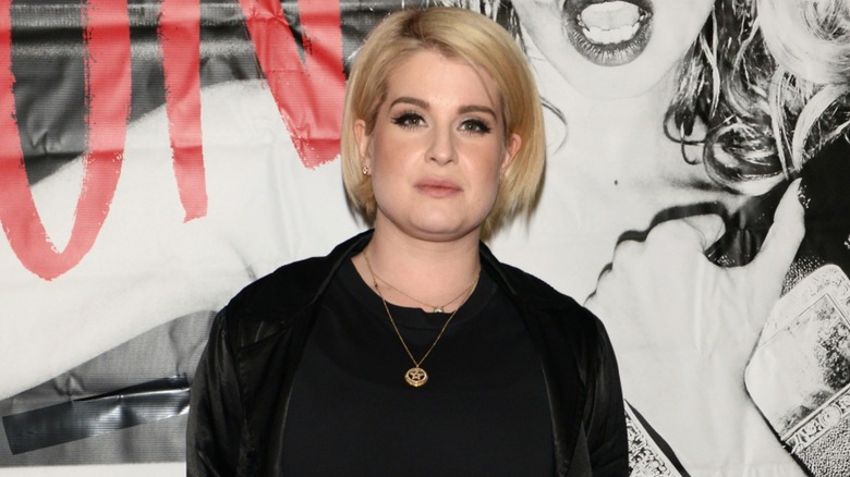 Kelly Osbourne on the red carpet in 2018 with short blond hair