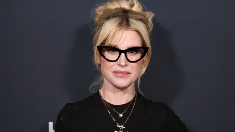 Headshot of Kelly Osbourne wearing large black glasses