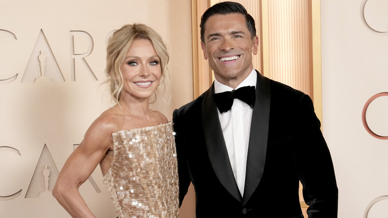 Kelly Ripa and Mark Consuelos posing together at the 2026 Academy Awards