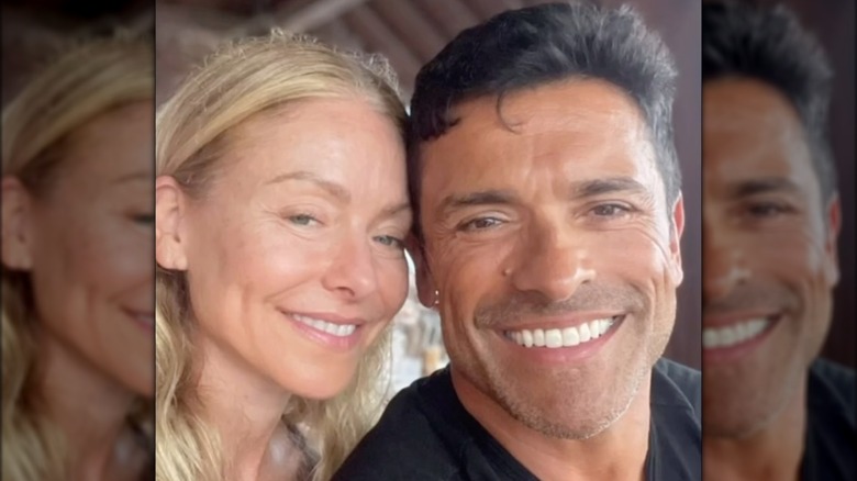 Kelly Ripa, wearing no makeup, smiling alongside her husband Mark Consuelos