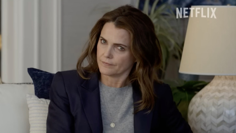 Keri Russell frowns with brown unbrushed hair wearing a blazer