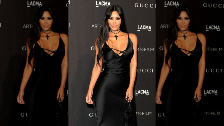 Kim Kardashian on the red carpet in a black dress