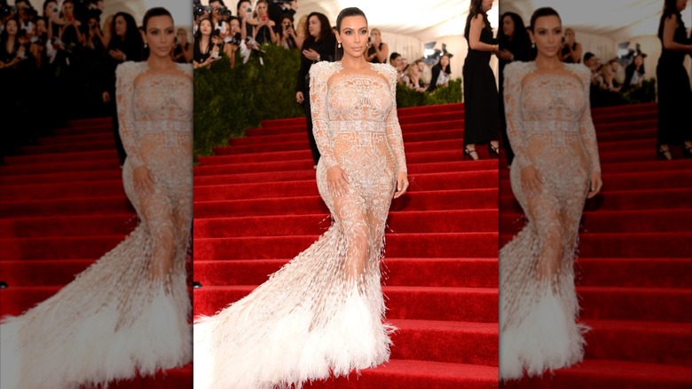 Kim Kardashian in a sheer feather dress at the 2015 Met Gala