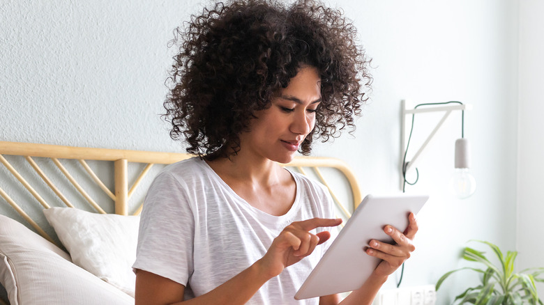 Woman holding an e-reader