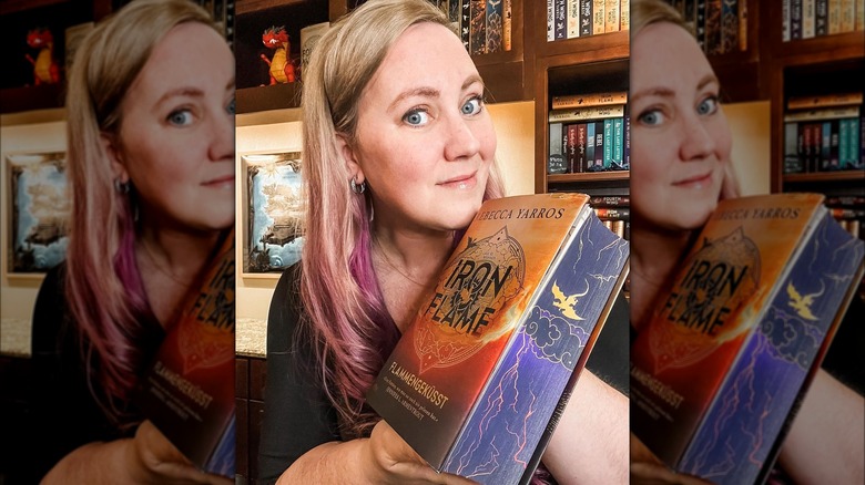 Rebecca Yarros with her book