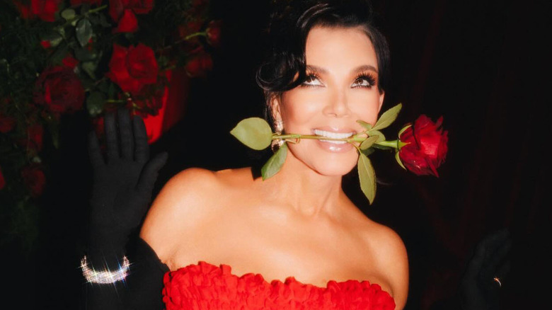 Kris Jenner holding a rose