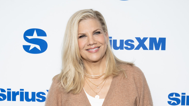 Kristen Johnston smiles on the red carpet in 2025