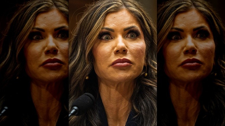 Kristi Noem in high-contrast lighting