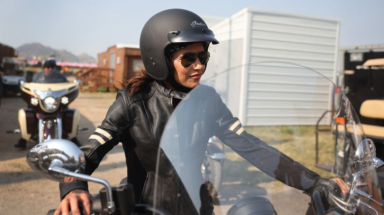 Kristi Noem dressed in motorcycle gear at a rally