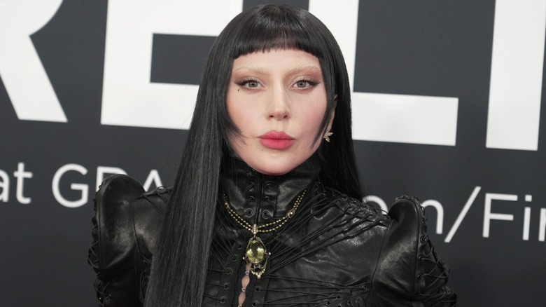 Lady Gaga on the red carpet in a black wig