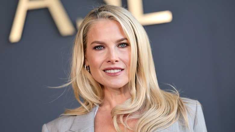 Ali Larter smiling on a red carpet