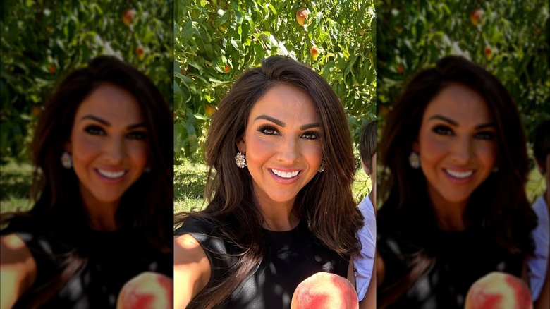 Lauren Boebert in a selfie holding a peach on Instagram