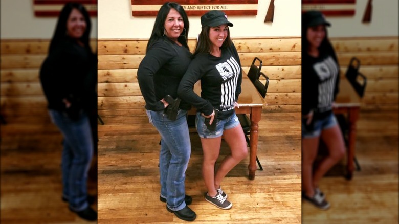 Lauren Boebert posing in denim shorts with a friend
