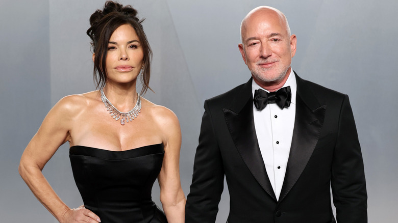 Lauren Sánchez Bezos and Jeff Bezos smile on the red carpet in 2026