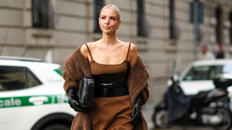 A woman in black, leather gloves 