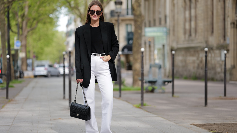 Woman posing in white denim