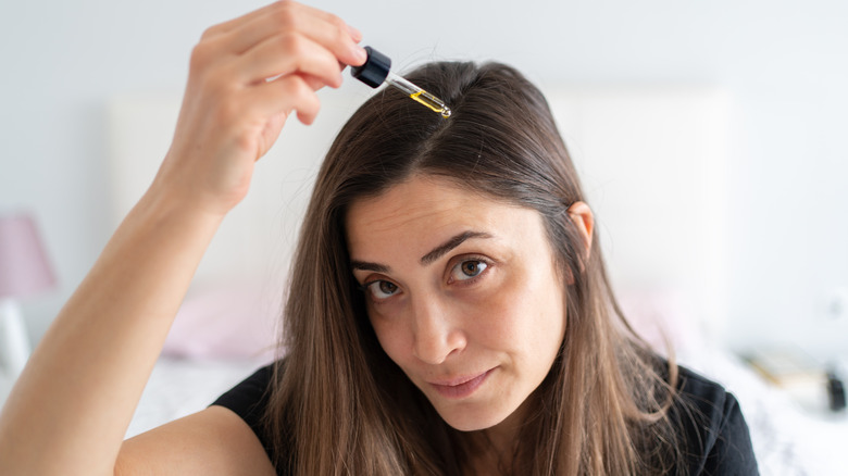 Woman treating her hair
