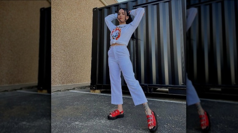 Woman wearing sandals and sweats
