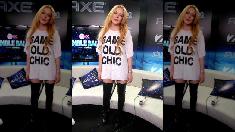 Lindsay Lohan in an oversized white tee that says "Same Old Chic"