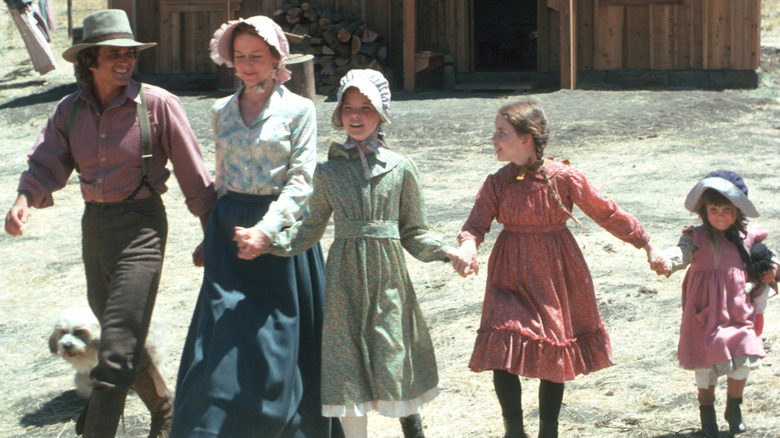 A promotional photo featuring the cast of "Little House on the Prairie" on set