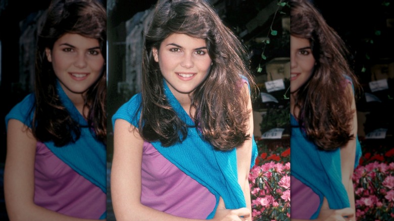 Lori Loughlin wearing a blue cardigan and pink top