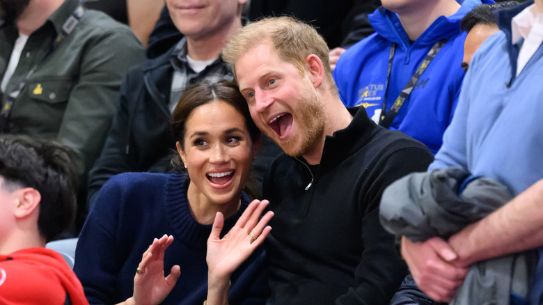 Prince Harry and Meghan Markle smiling together during the Invictus Games