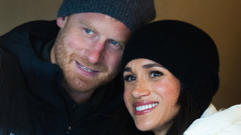Prince Harry and Meghan Markle close together in winter clothes in Canada
