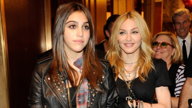 Lourdes Leon in front of her mom in 2010 wearing a studded, leather-look jacket