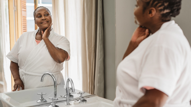 Woman applying skincare