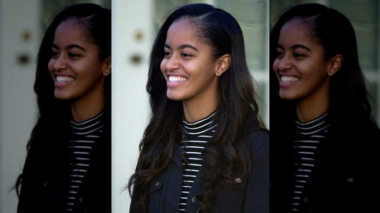 Malia Obama wearing her long hair with curls in the ends at a 2015 event