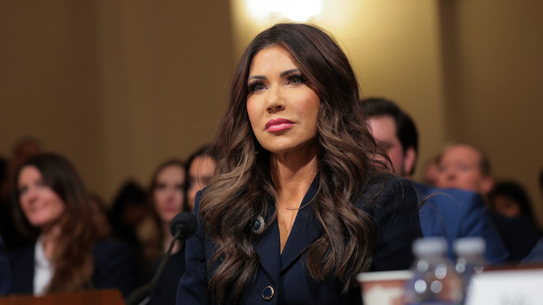 Kristi Noem sitting at a table