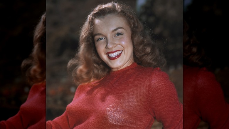 Marilyn Monroe in red jumper and reddish brown hair