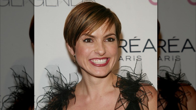 Mariska Hargitay wearing a black feather dress and black eyeliner