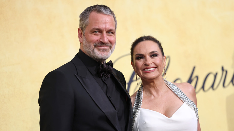 Peter Hermann and Mariska Hargitay smile on the red carpet
