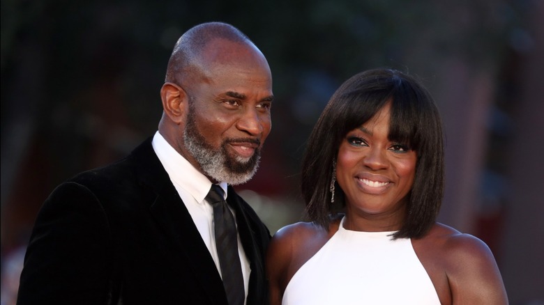 Viola Davis in white halter neck smiling with husband Julius Tennon