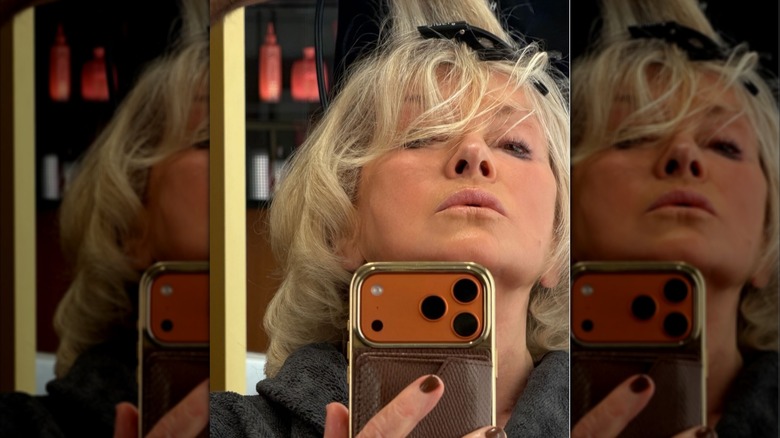 Martha Stewart taking a selfie with brown nail polish on