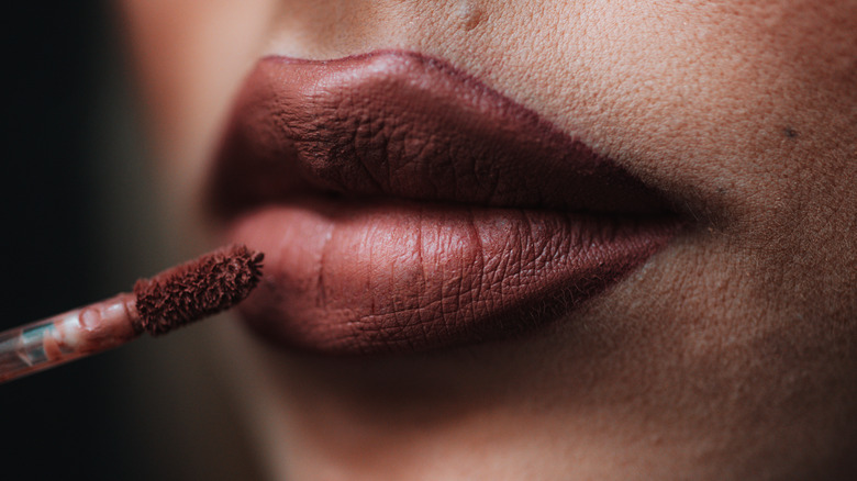 Applying matte lipstick