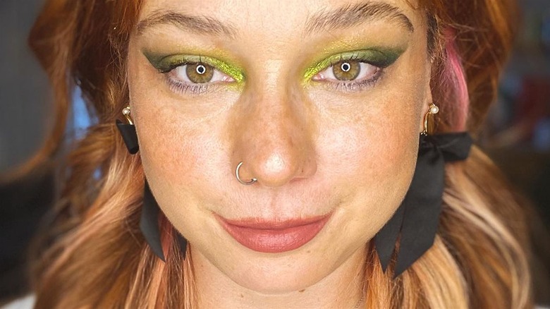 Woman wearing green eyeshadow